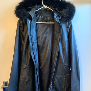 Leather jacket with hood and trim fur